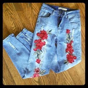 Stretch distressed jeans with floral embroidery